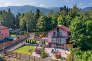 an aerial view of a house with a backyard at Forest Spa House 