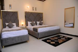 Krevet ili kreveti u jedinici u okviru objekta Go Room Hotel Lahore