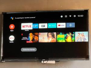 a tablet computer screen with many different videos on it at The Shed Venue & Boutique Hotel in Lilongwe
