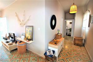 a living room with a clock on the wall at Casa Corales in Costa Teguise