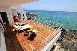 a deck of a cruise ship with the ocean at Casa Corales in Costa Teguise