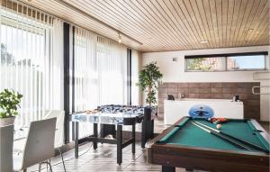 a billiard room with a pool table and a pool table at Pet Friendly Home In Hvide Sande With Kitchen in Havrvig
