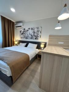 Voodi või voodid majutusasutuse Apart Astana toas