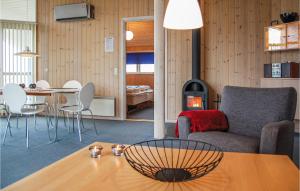 a living room with a couch and a table at Gorgeous Home In Hvide Sande With Sauna in Havrvig