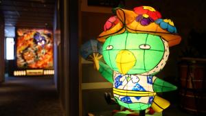 a colorful toy chicken with a hat on a wall at Dormy Inn Aomori Natural Hot Spring in Aomori