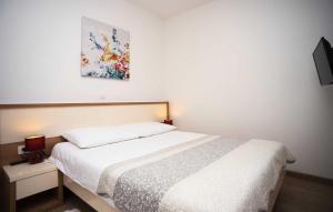 Postel nebo postele na pokoji v ubytování Holiday Home Leon