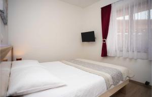 Postel nebo postele na pokoji v ubytování Holiday Home Leon