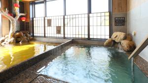 a large pool of water with teddy bears in it at Dormy Inn Aomori Natural Hot Spring in Aomori