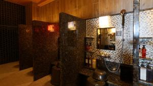 a bathroom with a shower and a sink at Dormy Inn Aomori Natural Hot Spring in Aomori