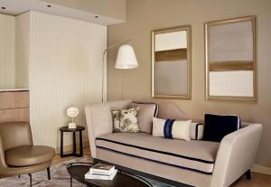 a living room with a couch and a chair at Grand Hotel Brioni Pula, A Radisson Collection Hotel in Pula