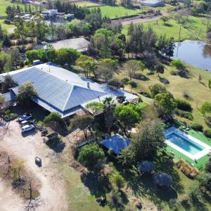 an overhead view of a house with a swimming pool at Hotel La Castellana in Paysandú