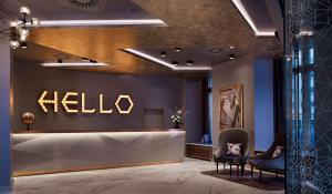 a lobby with a hello sign on the wall at Park Plaza Nuremberg in Nürnberg