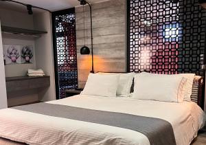 Letto o letti in una camera di Hotel D' Leon