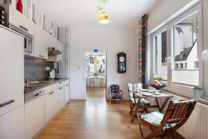 a kitchen with a table and a dining room at Schatzkiste Brilon in Brilon