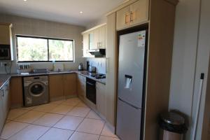 a kitchen with a refrigerator and a dishwasher at Sea Breeze West 5 in Margate
