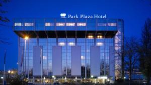 a building with a sign on top of it at Park Plaza Utrecht in Utrecht