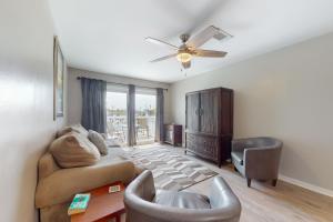 a living room with a couch and a ceiling fan at Perdido Dunes #20 in Orange Beach +24 photos