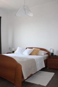 Кровать или кровати в номере Apartman Maslina