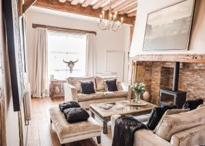 a living room with a couch and a table at Taylour House - Edenbridge, sleeps 10, historic, unique yet modern in Kent
