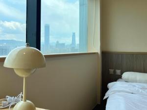Postel nebo postele na pokoji v ubytování 小隱居Hermit Dorm-聖雄商旅