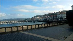 a view of a harbor with boats in the water at Apartamento Centro de Baiona con Parking in Baiona