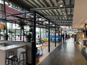 a lobby of a restaurant with tables and chairs at Serways Hotel Lüneburger Heide West in Behringen +18 photos