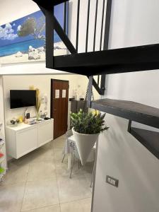 A television and/or entertainment centre at Dimora Asmara 11 15