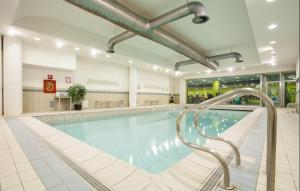 a large swimming pool in a large building at villaggio olimpico in Sestriere