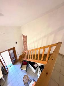 an overhead view of a room with a staircase at San Teodoro Appartamento Vacanze Centro in San Teodoro +6 photos