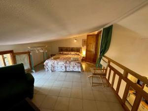 a large bedroom with a bed and a balcony at San Teodoro Appartamento Vacanze Centro in San Teodoro