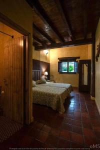 เตียงในห้องที่ Casa rural la corva