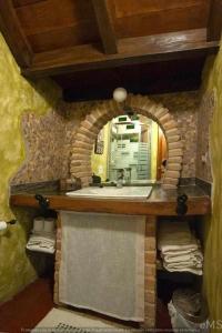 a bathroom with a sink and a mirror at Casa rural la parda in Triollo