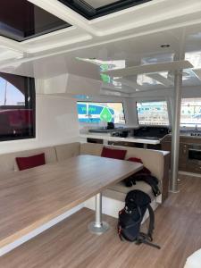 an office with a wooden table and a desk at Private Exclusive Catamaran 'Hang Loose' in Barcelona
