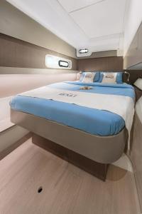 a large bed in the middle of a boat at Private Exclusive Catamaran 'Hang Loose' in Barcelona