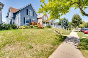 a home with a blue house and a sidewalk at Pet-Friendly Home - 6 Mi to Downtown Milwaukee! in West Allis
