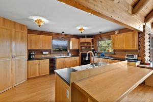 a kitchen with wooden cabinets and a counter top at 13655 County Road 1 in Ridgway