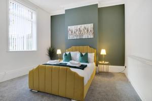 a bedroom with a large bed and a large window at Spacious & Modern Oasis, 4-Bed House, Sleeps 7 in Sunderland