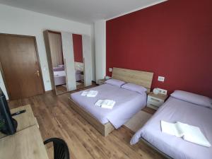 Postelja oz. postelje v sobi nastanitve Albergo Al Trieste
