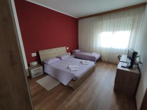 Postelja oz. postelje v sobi nastanitve Albergo Al Trieste