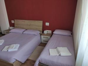 Postelja oz. postelje v sobi nastanitve Albergo Al Trieste