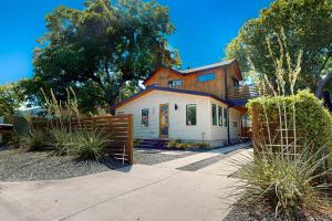 a house with a fence in front of it at Cozy Austin Hideaway in Austin