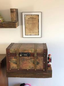 an old trunk sitting on top of a wall at Luxury House in Camber Sand Beach is 2min Walk !! in Rye
