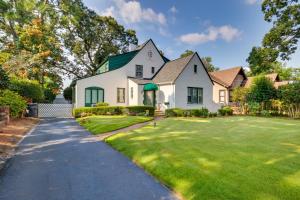 a white house with a green roof and a driveway at Augusta Vacation Rental about 5 Mi to Downtown in Augusta