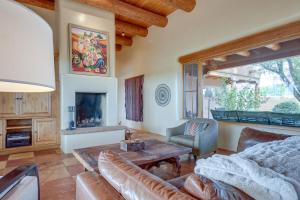 a living room with a couch and a table at Spacious Santa Fe Vacation Rental about 5 Mi to Town! in Santa Fe