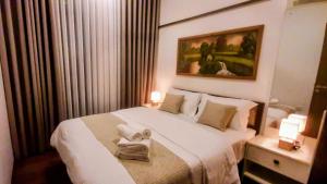 Ένα ή περισσότερα κρεβάτια σε δωμάτιο στο Cosy home in heart of Colombo at Capitol Twinpeaks.