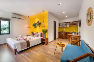 Postel nebo postele na pokoji v ubytování December Hoi An Villa