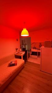 a red living room with a couch and a table at Beautiful apartment Lena in Split