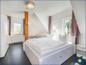 Ein Bett oder Betten in einem Zimmer der Unterkunft Kirchstr 4a
