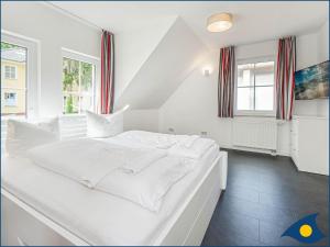 Ein Bett oder Betten in einem Zimmer der Unterkunft Kirchstr 4a