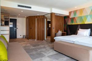 Ένα ή περισσότερα κρεβάτια σε δωμάτιο στο Austria Trend Hotel Ljubljana +37 φωτογραφίες